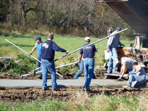 Construction personnel work on part of the recreation trail being installed near Caldwell Park. 