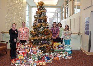 Mahaska Health Partnership Inpatient Services hosted a holiday Food and Supply Drive to benefit the Ecumenical Food Cupboard of Oskaloosa. MHP employees from throughout the health system donated food and hygiene items to assist those in need this holiday season. Members of Inpatient Services pictured with the donations are, from left: Torri Schmitz, Tricia Van Waardhuizen-Orr, Summer Lovitt, Laura Doscher and Harmony Edge.  