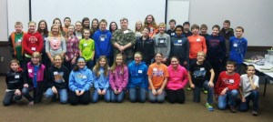 Lynnville-Sully’s sixth graders with Rusty Harvey (center), a person receiving services from COC. (submitted photo)