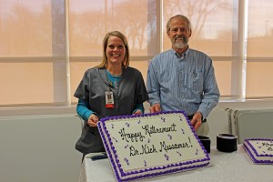 1.Family Practice Physician Dr. Nick Messamer holds up his retirement cake with his nurse Ashley Perkins. A retirement party was held Dec. 30 at MHP to celebrate Dr. Messamer’s medical career with his family and his MHP family. 