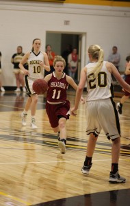 Oskaloosa Senior Taylor Richardson drives against E-B-F on Friday night. (photo by Denis Currier/Oskaloosa News)