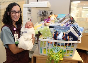 Dr. Bridget Shariat Delivers First Baby of 2015 – Hunter Myles was born at 2:13 pm on Jan. 3, making him Mahaska Health Partnership’s first baby of 2015. Hunter weighed 7 pounds, 15 ounces and was 21.5 inches long at birth. As MHP’s first baby of 2015, Hunter received a wide variety of gifts from MHP and Whispering Tree Gifts, the Hospital Auxiliary’s gift shop located on the lower level of the new patient care wing. Hunter is shown with his delivering physician, Dr. Bridget Shariat and his welcome basket. 