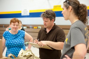 Heather Doak (left) and Ben Doak (center) finish up their first day as coordinators for the Bountiful Baskets program in Oskaloosa.