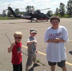 Sean, (6), Brendan (5), and Liam (9) Bowman stand in front of Donald Trumps helicopter on Saturday. (photo by Sarah Bowman)