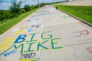 Taylor Green (far right near back of photo) puts the finishing touches on her work along 'Indian Trail'.