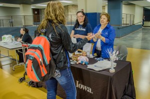 Vicki Jones of Bank Iowa was one of several area business people on hand Tuesday to greet Penn students back to Oskaloosa.