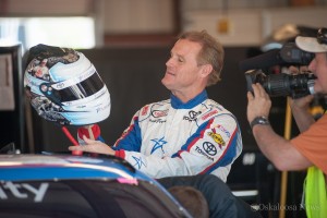 Kenny Wallace inspects a specially prepared helmet for his final NASCAR race over the weekend at Iowa Speedway.