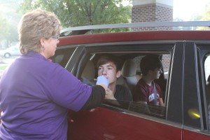 Fifteen-year-old Jack Miller of Oskaloosa is one of 146 people to get a flu vaccination at the Drive-Thru Flu Clinic on Saturday, Sept. 26 at Mahaska Health Partnership. He is shown receiving the flu mist from MHP Public Health Nurse Judi Veldhuizen. The clinic was sponsored by MHP Public Health. Walk-in Flu Vaccination Clinics are still available at Public Health (entrance #1) Mondays from 8:00 am to Noon and Thursdays from 1:00 to 4:00 pm. Flu vaccines outside the scheduled clinics are available by appointment. Please call 641.673.3257. The flu shot and flu mist are $25. High dose vaccine for people 65 years and older is also available for $30. Medicare Plan B can be billed with proof of card. MHP Public Health also participates in the Vaccines for Children (VFC) program that provides flu vaccines to Medicaid, underinsured and uninsured children ages 6 months to 18 years old. 