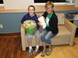 In honor of National 4-H Week, Mahaska Masters 4-H Club members wanted to give back to the community. They decided to present a gift to the first baby born at the MHP Birthing Center during the celebratory week. Honoree Jayla Magee, daughter of Ashley McCombs and Quinn Magee of Oskaloosa, was born Sunday, Oct. 4 at 9: 15 am. She measured 19 inches long and weighed exactly 7 pounds. Jayla is pictured with 4-H leader Karen Adams while club member Sydney Septer presents the gift. 