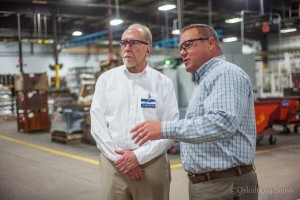 Congressman Dave Loebsack (left) and Clow General Manager Mark Willett (right) on a tour of the Clow facility last week.