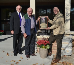 COC Executive Director Rod Braun (left) with former Executive Director Bruce Nikkel (middle) and first Executive Director Harold Eiten (right) in front of the Eiten Entrance