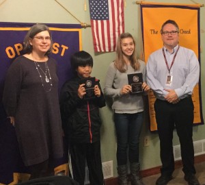 Oskaloosa Middle School students, Theodore Torees, second from left, and Rylee Ebelheiser, were named students of the trimester by Oskaloosa Optimist Club President Jane Krutzfeldt, left, and middle school principal Andy Hotek, far right.