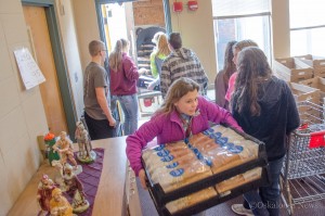 Oskaloosa Middle School students help unload the trucks of food that went into the Rotary Christmas Dinner Boxes.