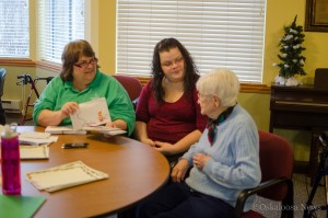 Sylvia Kelderman (center) is one of the many volunteers helping to coordinate with Santa this Christmas Season.