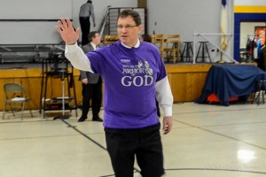 Dr. Bob Stouffer waves to parents at a recent assembly.