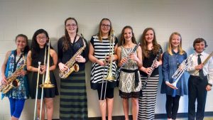 Students left to right: Sage Adam, alto saxophone; Mina Kim, trombone; Madeline Steinbron, alto saxophone; Ashlyn McDougall, trombone; Ella Roach, clarinet; Marissa Katko, clarinet; Abby Drost, trumpet; Carter Waddington, percussion.