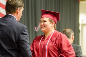 OHS Senior Erin Shannon receives her diploma from Superintendent Russell Reiter on Sunday afternoon.