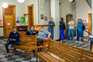 Individuals gathered at the Mahaska County Courthouse on Tuesday evening to watch returns from the LOST vote on May 3, 2016.