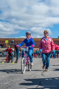 Taking off for herself on her own for the very first time, this young Oskaloosa bicycle rider enjoys the bicycle rodeo.