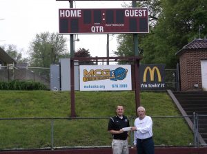 OSKALOOSA ELKS DONATE $2000 TO NEW SCOREBOARD Dean Mattix (right) presents Oskaloosa Community Schools Activities Director Ryan Parker with a $2000 check for the new scoreboard at the Oskaloosa Middle School Stadium. This money came from an Elks National Foundation (ENF) Gratitude Grant, part of the Elks Community Investment Program to better local communities. The Oskaloosa Elks raise funds throughout the year to contribute to ENF. 
