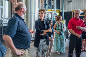 Iowa Lt. Governor Kim Reynolds (center) meets with staff members from Mahaska.