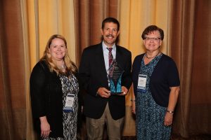 Shown with the Excellence in Patient Care Award from the Studer Group, an outcomes-based healthcare performance improvement company; are MHP Director of Surgical Services Michele Manternach, RN; MHP CEO Jay Christensen and MHP Chief Nursing Officer Darlene Keuning, RN, BSN, MS.
