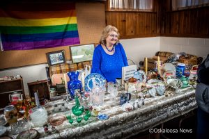 Linda Fox with treasures from the past at the holiday bazaar.