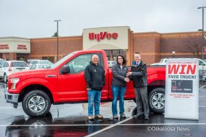 Brenda Sytsma is handed the keys by Oskaloosa Hy-Vee manager Clete Hjorth to the new truck the Oskaloosa store gave away.