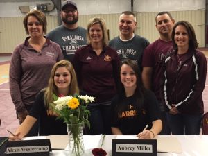Alexis Westercamp and Aubrey Miller from Oskaloosa along with Coach Harms and Coach North. They signed their letter of intent to play softball for Indian Hills!  (submitted photo)