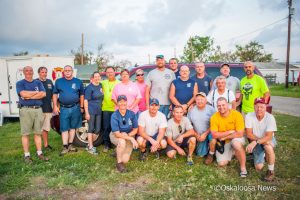Firefighters from Biloxi, Keesler AFB, Oskaloosa, Gladbrook, and New Sharon take a moment to pose for a group photo before starting a new day of helping people in Rockport, Texas.