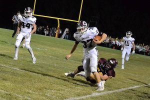 Jaden Van Roekel powers past Mt. Pleasant in a 57-yard run to set up an Oskaloosa TD just before the half. (photo by Wendy Van Roekel)