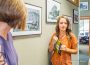 Oskaloosa Main Street Director Emily Brown talks about Oskaloosa history with guests at an open house in her honor this past week.