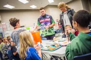 Tyler Menninga signed autographs for Oskaloosa 4th grade students on Thursday.