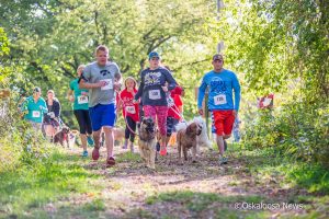 Participants take off for the SMAS 5K on Saturday at Lake Keomah.