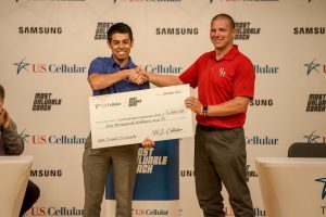 Coach Ryan Groom (right) accepts a check from US Cellular for $5000 as part of "Most Valuable Coach" program. (photo by Alisha Linder)