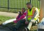 Mahaska County Deputy Ben Johnston (right) speaks with accident victim Erica on Friday. A moment captured by Oskaloosa Firefighter Day Hoy.