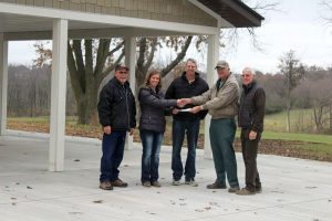 Mahaska County Farm Bureau partnered with MCRF earlier this year to see the project installed. Don Vos, Tom Jackson, and Stacie Boender met with MCRF Board members Carl Drost and Joe Crookham at the sight on Tuesday, November 14th as Farm Bureau presented a $20,000 check toward the project. (submitted photo)