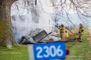 Oskaloosa firefighters extinguish the remaining fire at 2306 Yarnell Avenue east of Rose Hill.