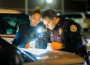 Oskaloosa Police Officer Janay Pritchett and Lieutenant Jacob Vanderpol check the results of a drug test during a traffic stop on Saturday evening.