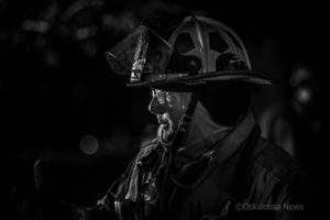 Oskaloosa Fire Department Captain Dave Christensen gives direction at a recent house fire in Oskaloosa.