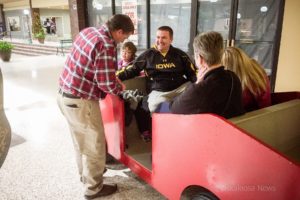 Mike Gipple (left) helps to make sure everyone is securely aboard before taking off on the Penn Central Express.