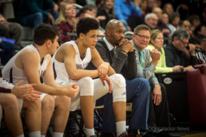 Xavier Foster (center left) with his father DaJuan Foster (center right) during an Indians game this year. (file photo)