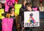 Melanie Mackey (left center) helped to organize the march around the square in Oskaloosa on Saturday to tie in with a bigger rally taking place on the state capitol grounds.