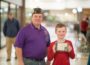 American Legion District Commander Darrin Alderson (left) and Blake Herny (right) pose with a challenge coin sent by Lt. Colonel Tanya Hildebrand.