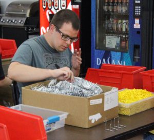 Sam Walker works at the Tenco in Ottumwa. On this day he was making mouse traps.