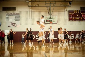 The Oskaloosa Indians celebrate their victory over the Newton Cardinals on Tuesday night.