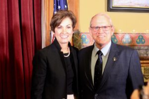 Gov Kim Reynolds (left) signed into law a water quality bill managed by Sen. Ken Rozenboom (right).