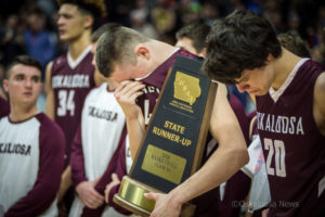 The pain of the moment hits Oskaloosa's Cole Henry and Rian Yates after the loss to Glenwood.
