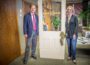 Eric Palmer (left) and Oskaloosa Chamber Director Ann Smith (right) pose with the door found during renovations.