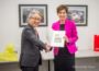 Ajinomoto President/CEO Takaaki Nishii and Iowa Governor Kim Reynolds exchanged gifts as part of a 25 year celebration for Ajinomoto.